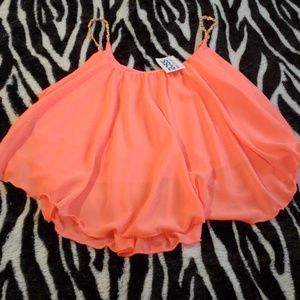 Bright orange crop top.